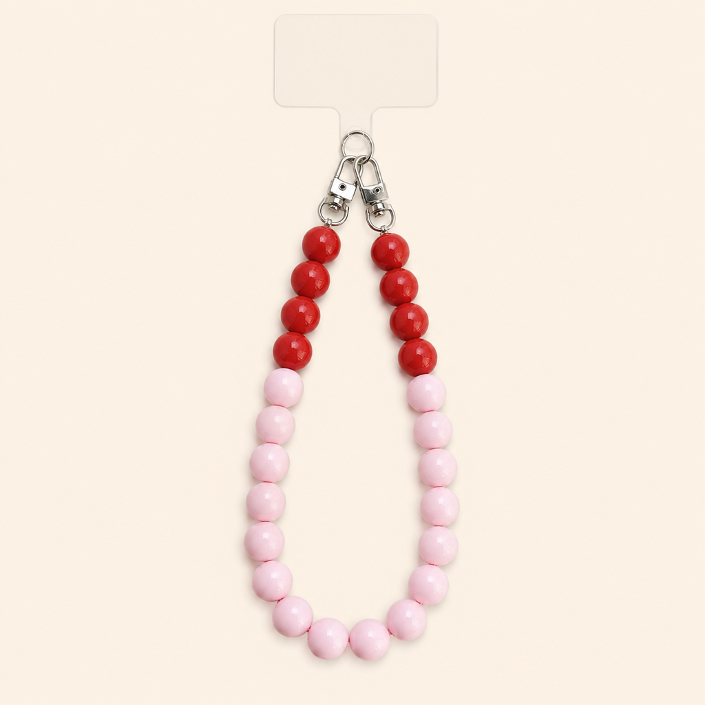 שרשרת CANDY LOOP לטלפון מחרוזי אקריל ורודים ואדומים על רקע שמנת