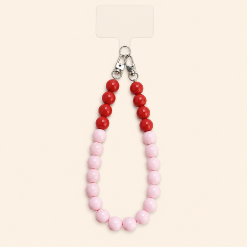 שרשרת CANDY LOOP לטלפון מחרוזי אקריל ורודים ואדומים על רקע שמנת