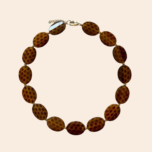 CHEETAH Necklace - exact original design on cream background